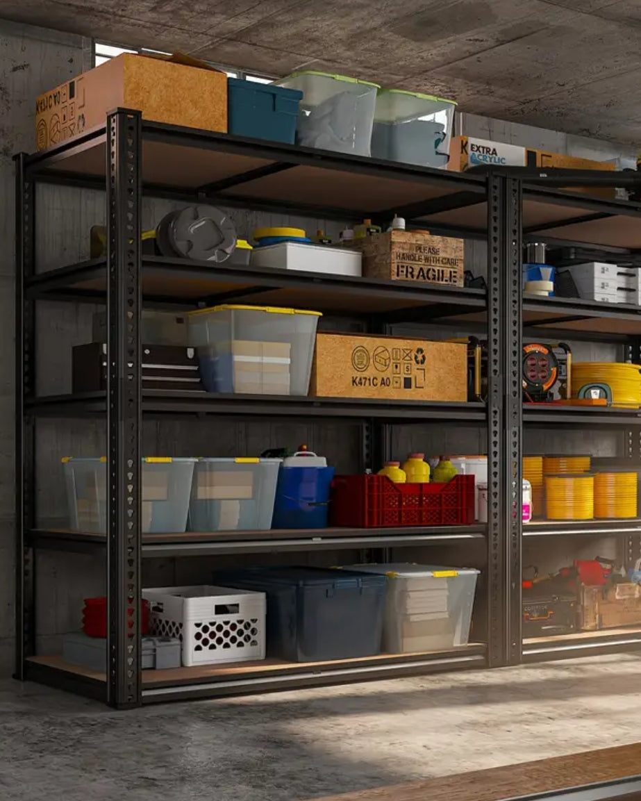Storage shelves with various boxes and containers in a concrete room.